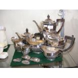A silver plated tea set together with silver decan