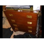 A small campaign chest with green leather inlay to