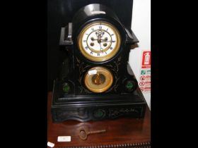 A Victorian slate mantel clock with barometer
