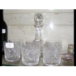 A cut glass decanter with six tumblers