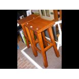 A pair of wooden bar stools