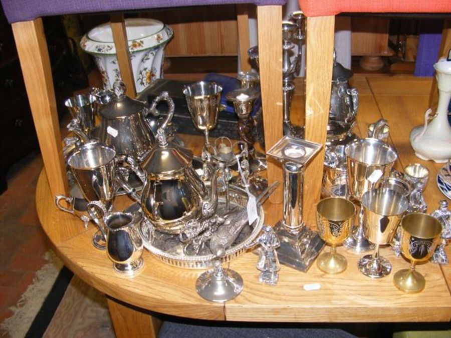 A medley of silver plated items