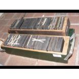 A wooden box of collectable magic lantern slides a