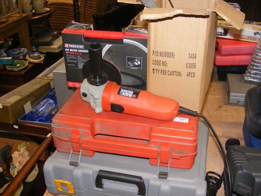 A Bosch electric drill, Ryobi dremel kit, together