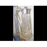 A silver mounted cut glass claret jug