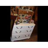 A modern white melamine chest of drawers together