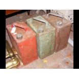 Three old petrol cans
