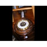 A late Victorian aneroid barometer and thermometer