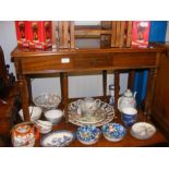 A reproduction mahogany occasional table with nest