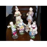 Three continental porcelain figures, together with