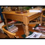 An antique pine coffee table with shaped supports