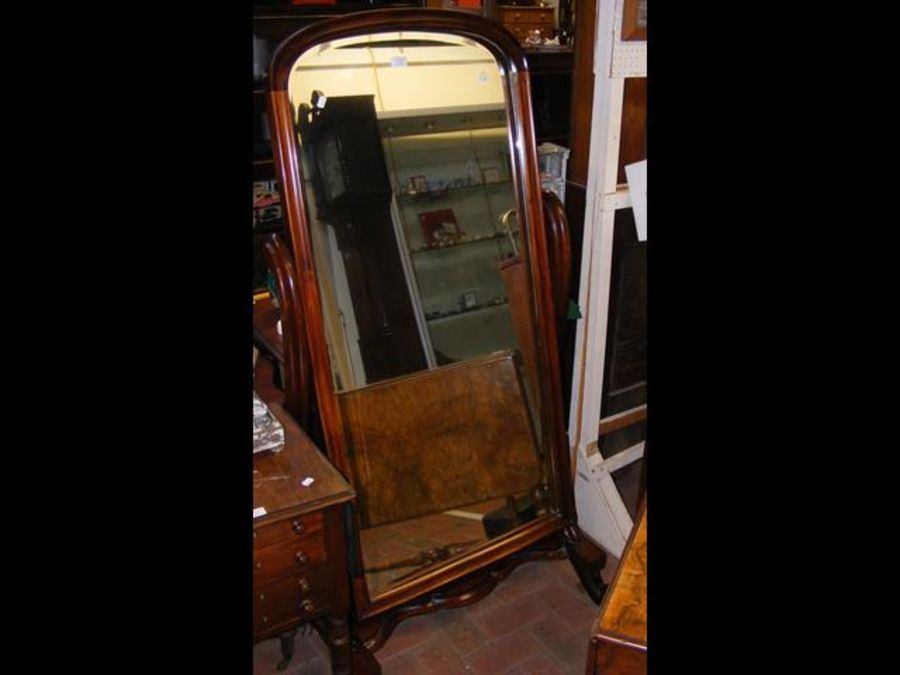 A Victorian style cheval mirror on shaped support