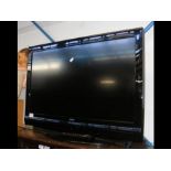 A Bush 31" flat screen TV - complete with remote