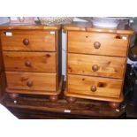 A pair of pine three drawer bedside cabinets