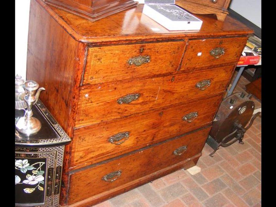 A Victorian scumbled pine chest of drawers