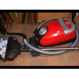 A Miele S5 cylinder vacuum cleaner with attachment