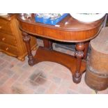 A Victorian D-shaped mahogany side table supported