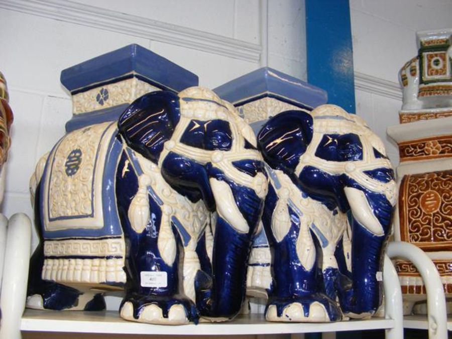 A pair of blue glazed ceramic elephant seats