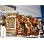 A pair of brown glazed ceramic elephant seats