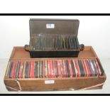 A wooden box of magic lantern slides of various su