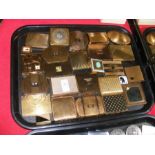 A tray containing various vintage compacts