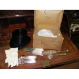 A boxed top hat and leather gloves, together with fish server,