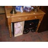 A pine dressing table, two drawers under, triple m