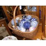 A basket of ceramic ball and egg ornaments etc