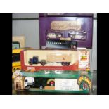 Seven boxed die cast trucks and cars