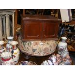 A small mahogany cupboard together with a circular