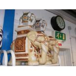 A pair of ceramic elephant stools, together with t