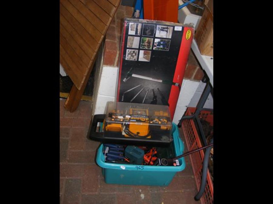 A box of new tools, including power sharpener, mul