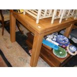 An Oak Furniture Land modern extending light oak dining table