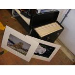 A cased collection of mounted colour photographs,