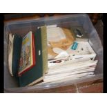 A box containing First Day Covers and collectable