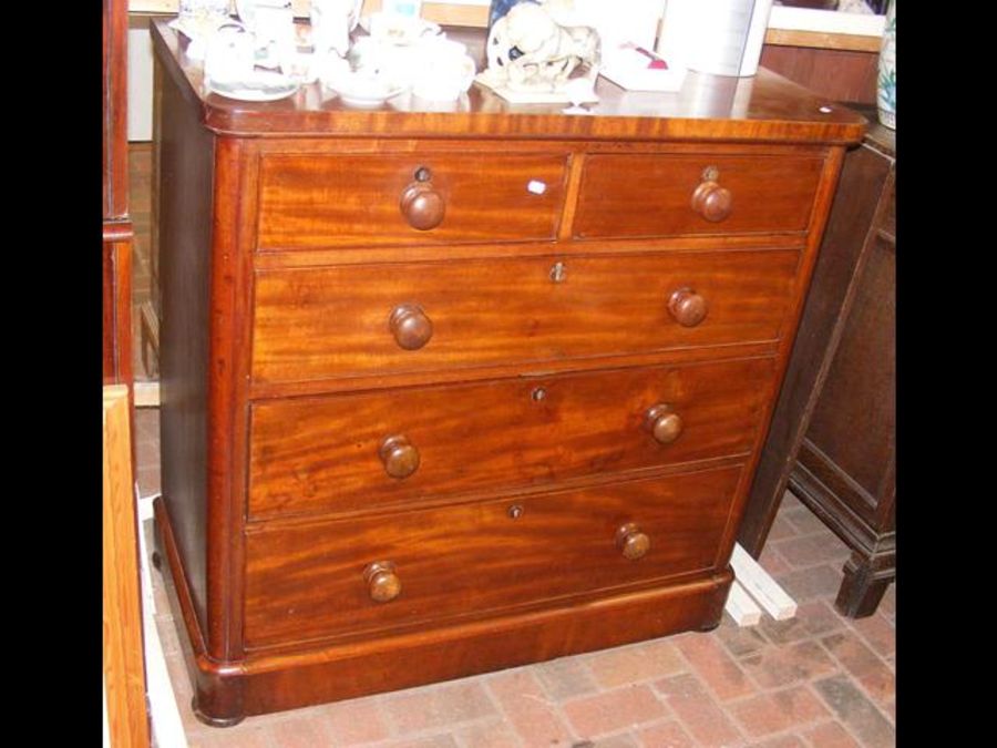 A Victorian cap top mahogany chest of drawers