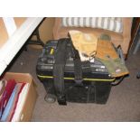 A black plastic toolbox, together with tool belts,