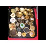 A tray containing various vintage compacts