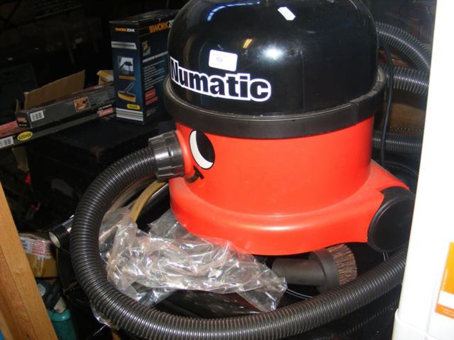 A numatic 'Henry' hoover with attachments