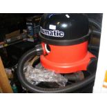 A numatic 'Henry' hoover with attachments