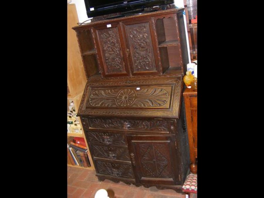 A carved oak bureau bookcase with fitted interior - Image 2 of 2