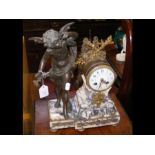 A French striking mantel clock with cherub surmoun