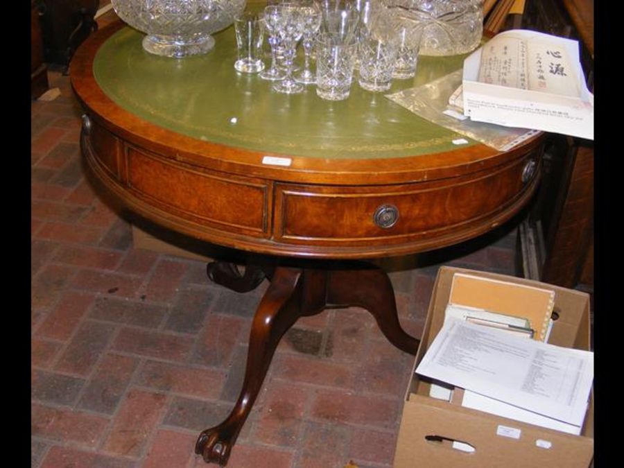 A reproduction drum table with green leather top -