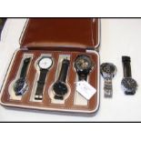 Six assorted fashion watches in leather case