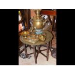An antique brass samovar in company with assorted