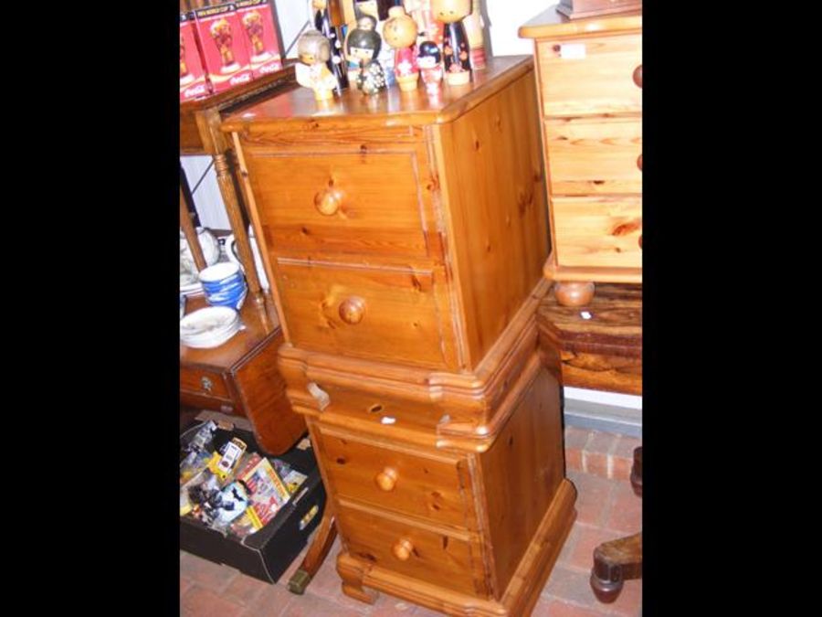 A pair of pine two drawer bedside cabinets