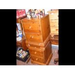 A pair of pine two drawer bedside cabinets