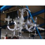 A modern five branch crystal chandelier