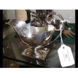 Silver sauce boat with footed base