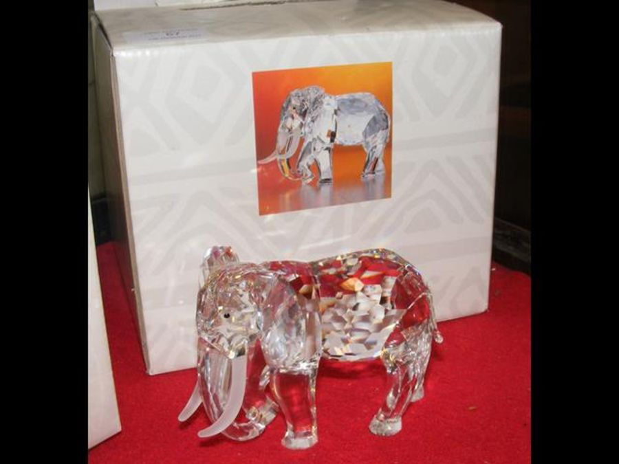 A boxed Swarovski crystal elephant - 9cms high wit